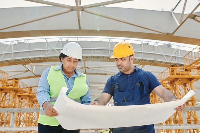 Engineers reviewing a site plan together